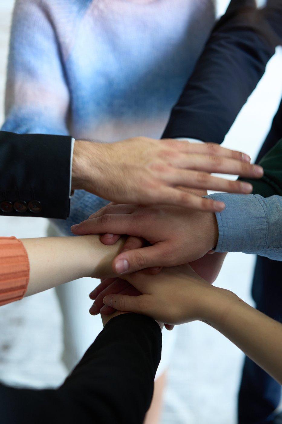 Hands joined together — partnership and teamwork